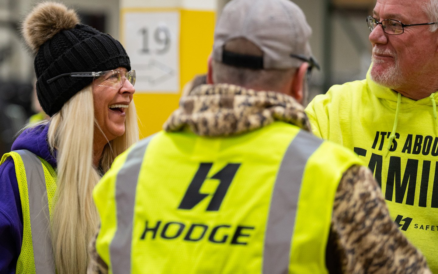 HODGE employees gathered around for team meeting