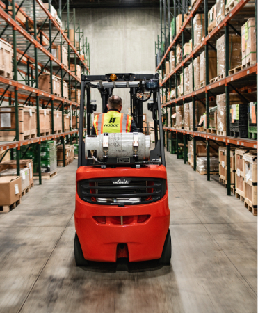 Forklift driving in warehouse
